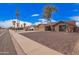 A pleasant residential street with well-kept homes and desert landscaping visible at 8738 W Mountain View Rd, Peoria, AZ 85345