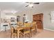 Dining area with tile flooring, a wooden table and chairs, a ceiling fan, and lots of natural light at 1010 E Vernoa St, San Tan Valley, AZ 85140