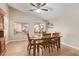 Dining area with tile flooring, a wooden table and chairs, and lots of natural light from the windows and sliding door at 1010 E Vernoa St, San Tan Valley, AZ 85140