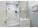 Bathroom featuring a tub shower, mirror, vanity, and modern sink at 10243 E Illini St, Mesa, AZ 85208