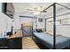 Bedroom featuring a metal bed frame, ceiling fan, and dark wood floors at 10243 E Illini St, Mesa, AZ 85208