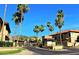 Inviting community entrance featuring lush landscaping and secured gate at 10410 N Cave Creek Rd # 1078, Phoenix, AZ 85020