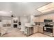 Open concept kitchen and living room with stainless steel appliances at 10410 N Cave Creek Rd # 1078, Phoenix, AZ 85020