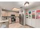 Bright kitchen features stainless steel appliances and ample cabinet space at 10410 N Cave Creek Rd # 1078, Phoenix, AZ 85020