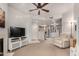 Spacious living room with carpet, fireplace, and a view into the kitchen at 10410 N Cave Creek Rd # 1078, Phoenix, AZ 85020