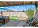 Charming backyard with a covered patio, perfect for outdoor dining and entertaining at 11604 S Ki Rd, Phoenix, AZ 85044