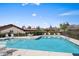 Refreshing community pool with lounge chairs, tables, and scenic views for relaxation and recreation at 11604 S Ki Rd, Phoenix, AZ 85044