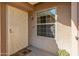 Charming entryway featuring a decorative security door, sidelight window and desert landscaping at 13828 S 42Nd St, Phoenix, AZ 85044