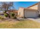 Inviting single-story home with a terracotta-tiled roof, lush lawn and mature landscaping enhancing curb appeal at 13828 S 42Nd St, Phoenix, AZ 85044