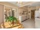 Bright kitchen features sliding glass door access to the covered patio, and light colored cabinets with a view to a breakfast nook at 13828 S 42Nd St, Phoenix, AZ 85044