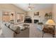 Comfortable living room featuring a fireplace, sliding glass doors to the backyard and backyard views at 13828 S 42Nd St, Phoenix, AZ 85044