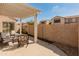 Comfortable covered patio with a neutral color scheme and seating area, perfect for relaxing outdoors at 13828 S 42Nd St, Phoenix, AZ 85044