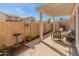 Charming patio area featuring a pergola, providing a cozy outdoor space with seating and landscaping at 13828 S 42Nd St, Phoenix, AZ 85044