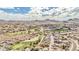 Expansive aerial view of a golf course community in a desert environment with mountain views at 14244 N 14Th Pl, Phoenix, AZ 85022