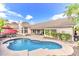 Resort-style backyard featuring a refreshing pool, desert landscaping, and mountain views at 14244 N 14Th Pl, Phoenix, AZ 85022