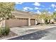 Charming house exterior with a three-car garage, well-maintained landscaping, and a driveway at 14244 N 14Th Pl, Phoenix, AZ 85022