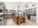 Spacious kitchen featuring a center island, stainless steel appliances, and custom cabinetry at 14244 N 14Th Pl, Phoenix, AZ 85022