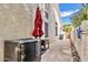 Side yard featuring desert landscaping, rock features, and a decorative wall at 14244 N 14Th Pl, Phoenix, AZ 85022