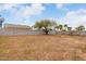 Spacious backyard with block wall, offering privacy and potential for landscaping and recreation at 15868 N 18Th N Pl, Phoenix, AZ 85022