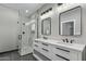 Contemporary bathroom featuring a glass shower, double vanity and modern fixtures at 15868 N 18Th N Pl, Phoenix, AZ 85022