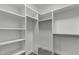 Organized walk-in closet with custom shelving for ample storage and organization at 15868 N 18Th N Pl, Phoenix, AZ 85022