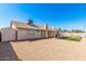 Spacious backyard featuring a small patch of artificial turf, and covered patio at 1614 W Beaubien Dr, Phoenix, AZ 85027