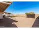 Spacious backyard with desert landscaping and covered patio area at 1614 W Beaubien Dr, Phoenix, AZ 85027