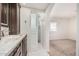 Well-lit bathroom with granite counters, a tiled shower, and modern finishes at 1614 W Beaubien Dr, Phoenix, AZ 85027