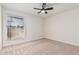 Bright bedroom with a ceiling fan and carpeted floors at 1614 W Beaubien Dr, Phoenix, AZ 85027