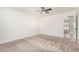 Neutral bedroom featuring a ceiling fan and plush carpet at 1614 W Beaubien Dr, Phoenix, AZ 85027