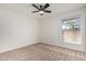 Bright bedroom with a window and carpeted floors at 1614 W Beaubien Dr, Phoenix, AZ 85027