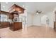 Open concept kitchen with custom hood, dark cabinets and stainless steel appliances at 1614 W Beaubien Dr, Phoenix, AZ 85027