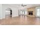 Open living room area featuring a fireplace, ceiling fan, and lots of space to entertain at 1614 W Beaubien Dr, Phoenix, AZ 85027