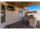 Outdoor kitchen featuring a built-in grill and counter space on the covered patio at 1614 W Beaubien Dr, Phoenix, AZ 85027