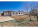 Exterior view of the property, featuring the spacious backyard with new seed at 17408 N 14Th Ave, Phoenix, AZ 85023