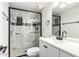 Modern bathroom featuring a sleek vanity, toilet, and luxurious walk-in shower with marble-like tile at 17408 N 14Th Ave, Phoenix, AZ 85023