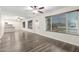 Inviting living room with ample natural light, wood-look floors, and views of the adjoining kitchen at 17408 N 14Th Ave, Phoenix, AZ 85023