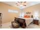 Bedroom featuring a bed with decorative pillows, two nightstands, and a plush chair at 1951 N 64Th St # 26, Mesa, AZ 85205