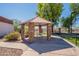 Outdoor gazebo featuring a picnic table, brick pillars, and lush greenery in a well-kept community at 1951 N 64Th St # 26, Mesa, AZ 85205