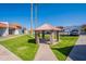 Community gazebo offering shade, a picnic table, and well manicured green spaces at 1951 N 64Th St # 26, Mesa, AZ 85205