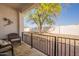 Inviting covered patio with seating and a view of the well-maintained backyard at 1951 N 64Th St # 26, Mesa, AZ 85205