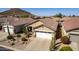 Single-Gathering home with desert landscaping, tile roof, and a two-car garage at 202 W Twin Peaks Pkwy, San Tan Valley, AZ 85143