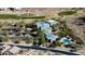 Aerial view of community center, with pool, golf course, and parking at 202 W Twin Peaks Pkwy, San Tan Valley, AZ 85143