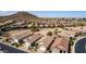 An aerial view of an Arizona neighborhood with desert landscaping and mountain views at 202 W Twin Peaks Pkwy, San Tan Valley, AZ 85143