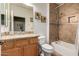 The bathroom has a tiled shower over the tub and a granite vanity at 202 W Twin Peaks Pkwy, San Tan Valley, AZ 85143