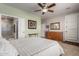 Cozy bedroom featuring a bed, dresser, closet, and natural light at 202 W Twin Peaks Pkwy, San Tan Valley, AZ 85143