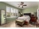 Serene bedroom with a ceiling fan, bright window, and stylish decor at 202 W Twin Peaks Pkwy, San Tan Valley, AZ 85143