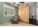 This bedroom features a murphy bed and shuttered windows at 202 W Twin Peaks Pkwy, San Tan Valley, AZ 85143