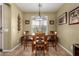 Inviting dining room with natural lighting and comfortable seating for six at 202 W Twin Peaks Pkwy, San Tan Valley, AZ 85143