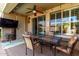 Covered patio with dining table and view of backyard at 202 W Twin Peaks Pkwy, San Tan Valley, AZ 85143